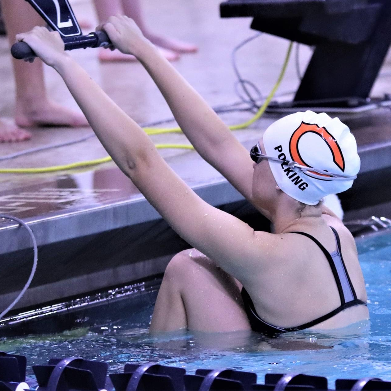 girl getting ready to do the backstroke