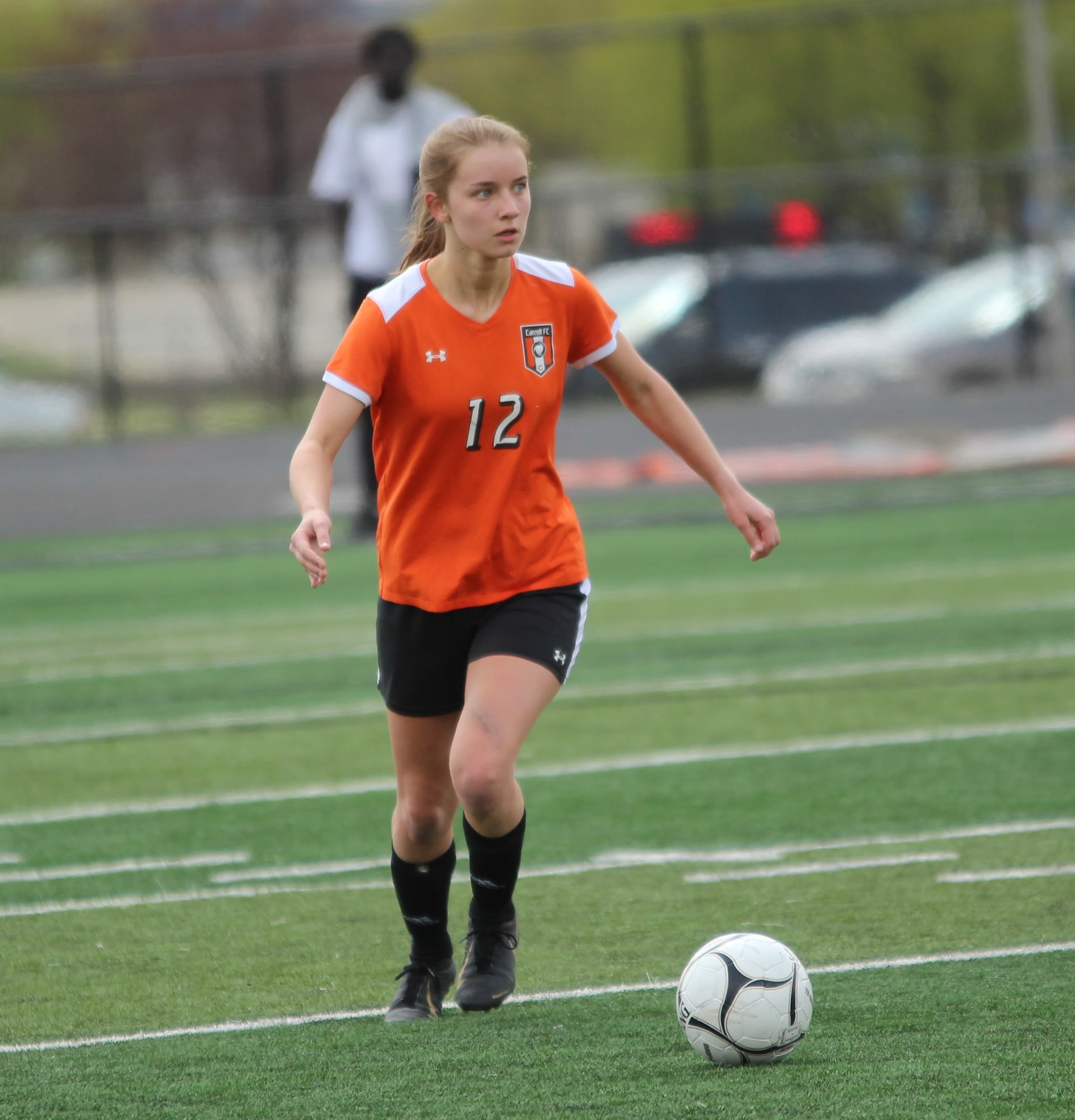 girl playing soccer