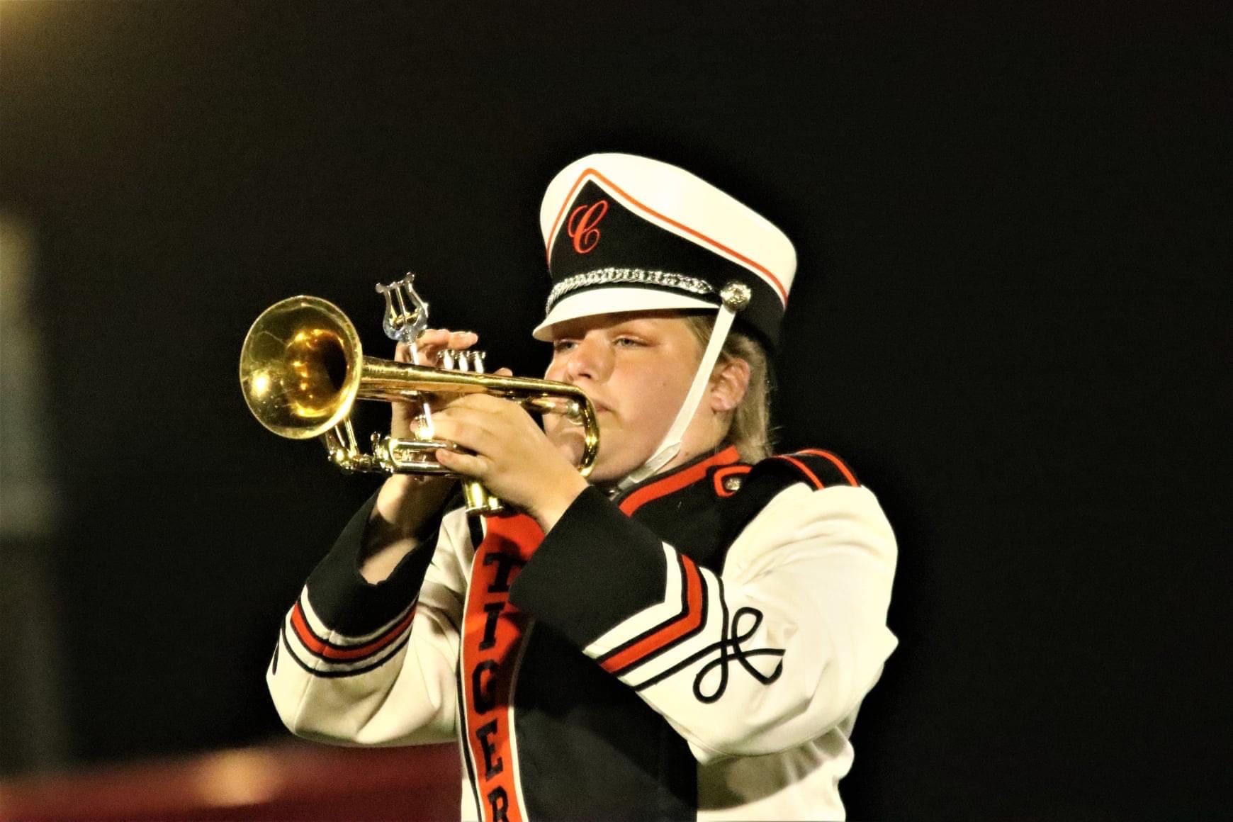 marching band member playing trumpet