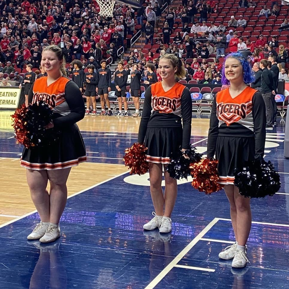 girls cheering at basketball game