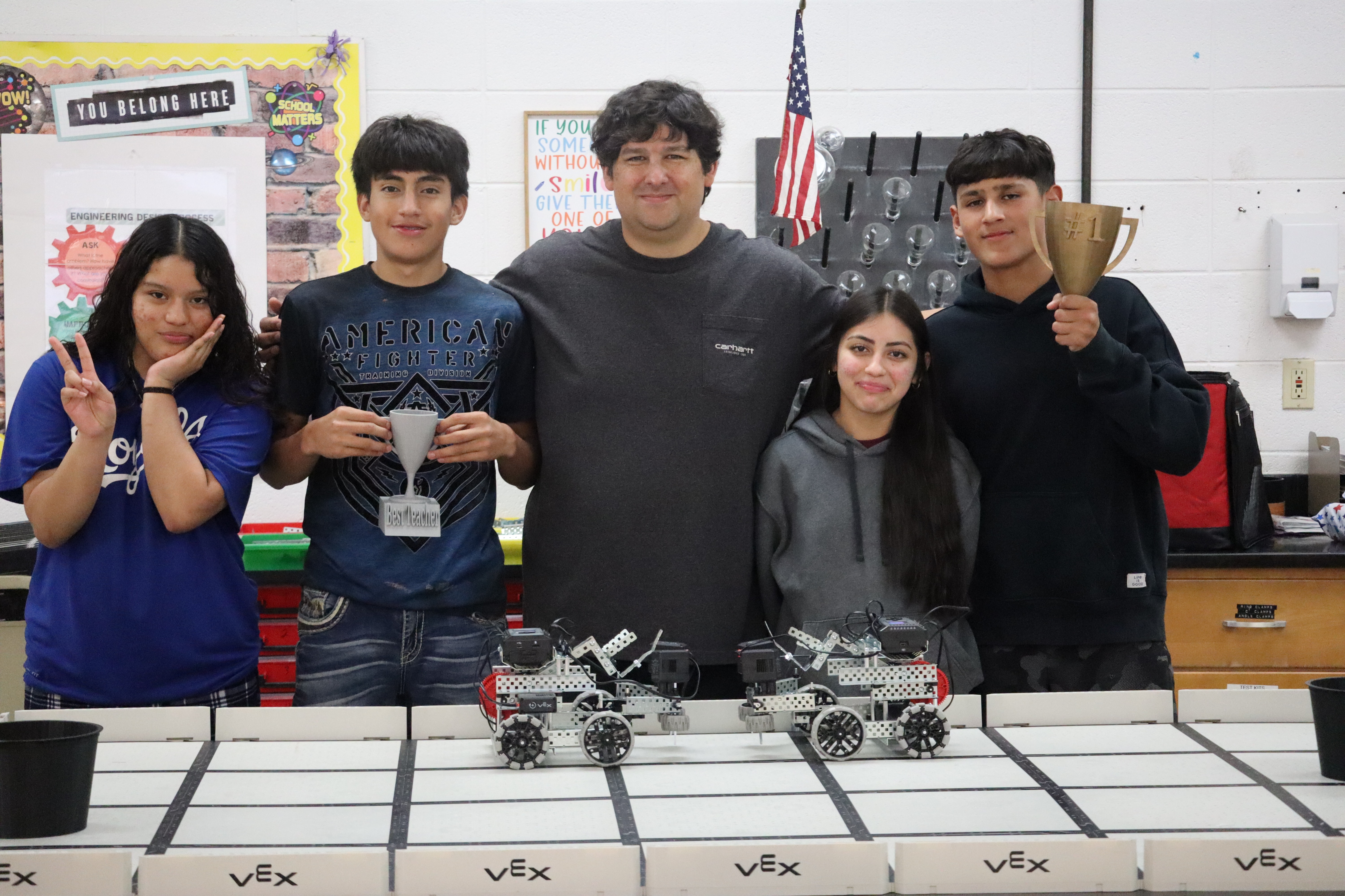 HS students posing with 3D printed items
