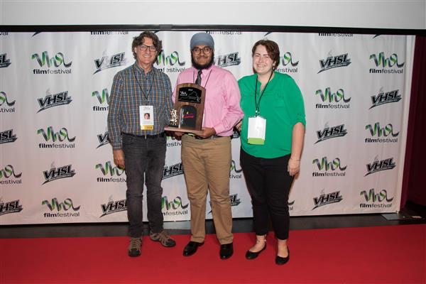 Juptej Singh and Danika Irish holding up their award