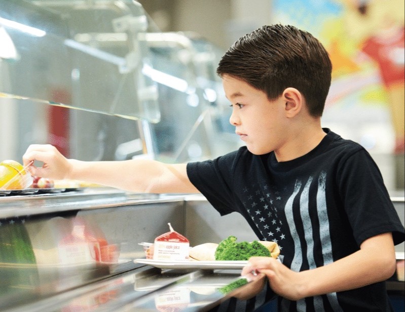 Boy grabbing food