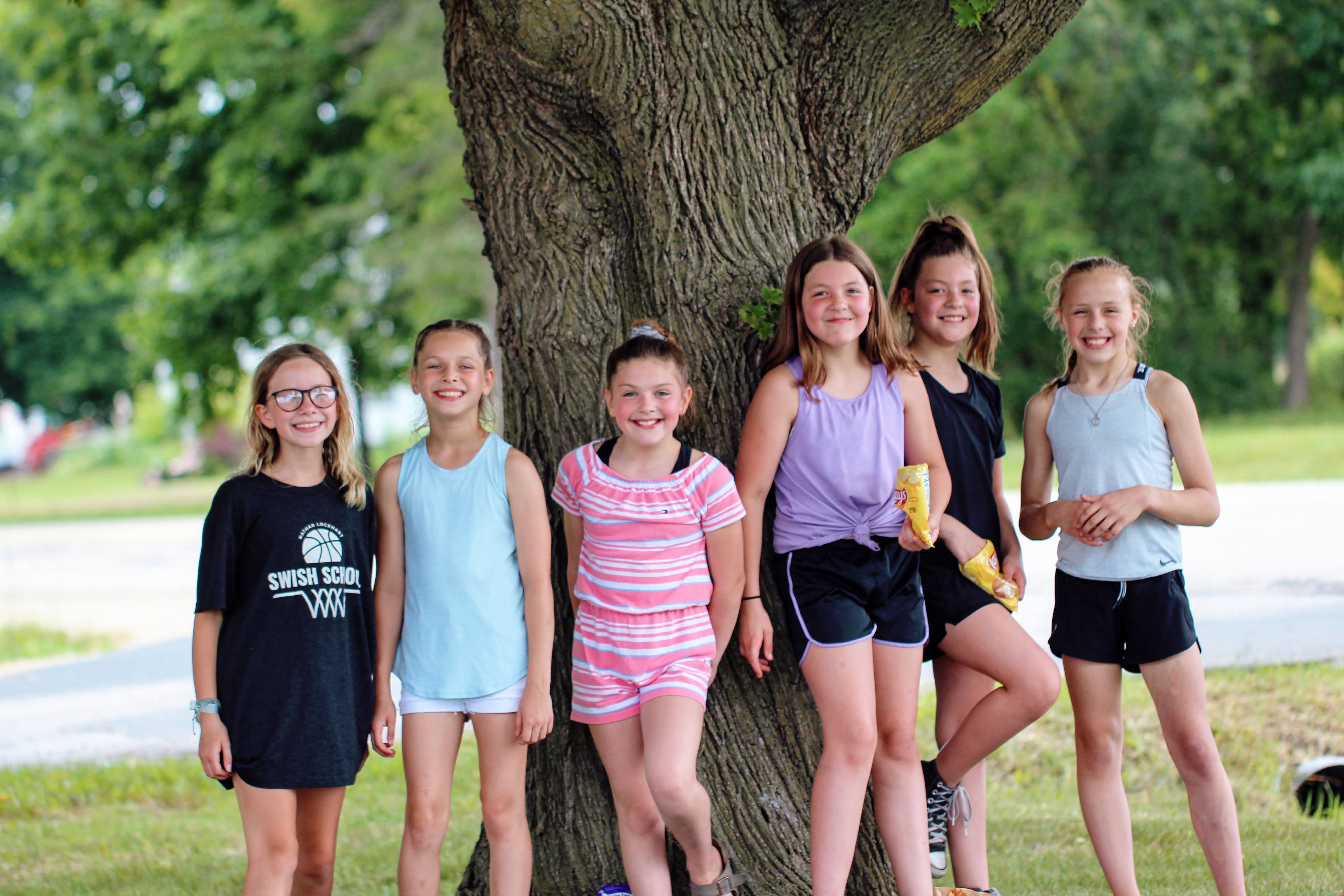 Tibbets students standing in front of a tree