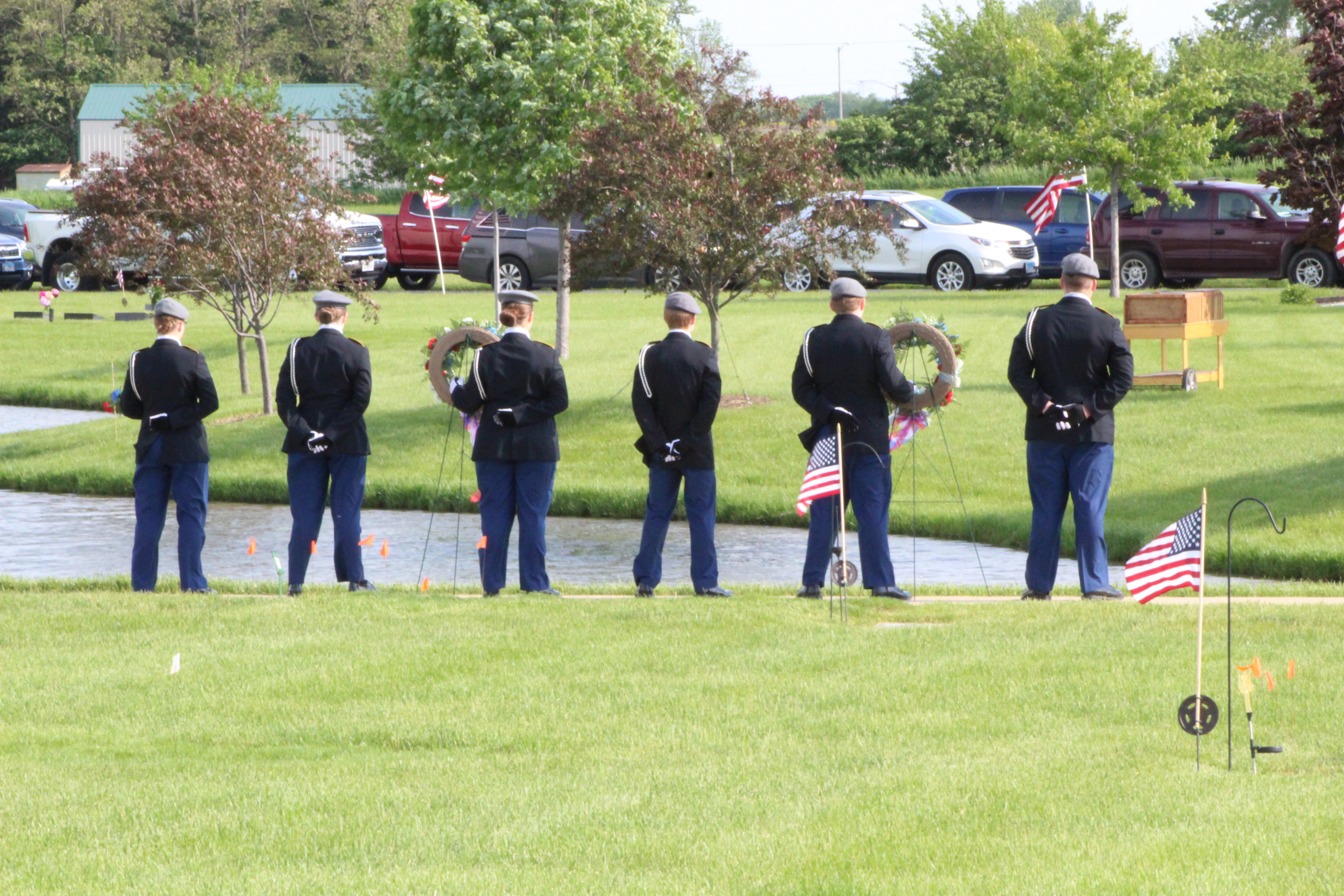A photo of the honor guard at a ceremony outside
