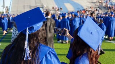 two students in graduation caps