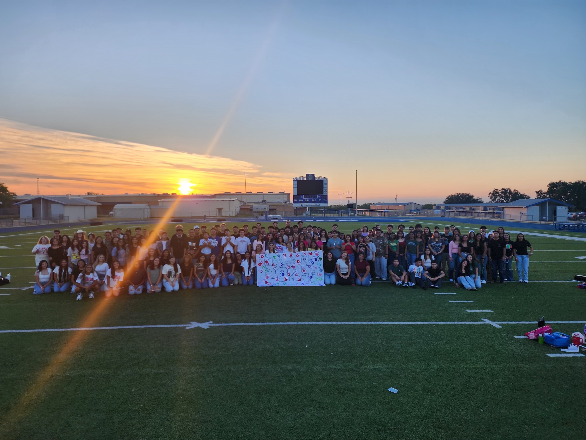 seniors in front of sunrise