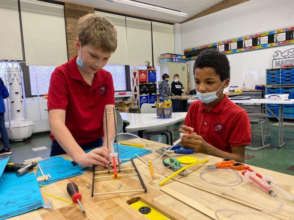 two cadets build a robot