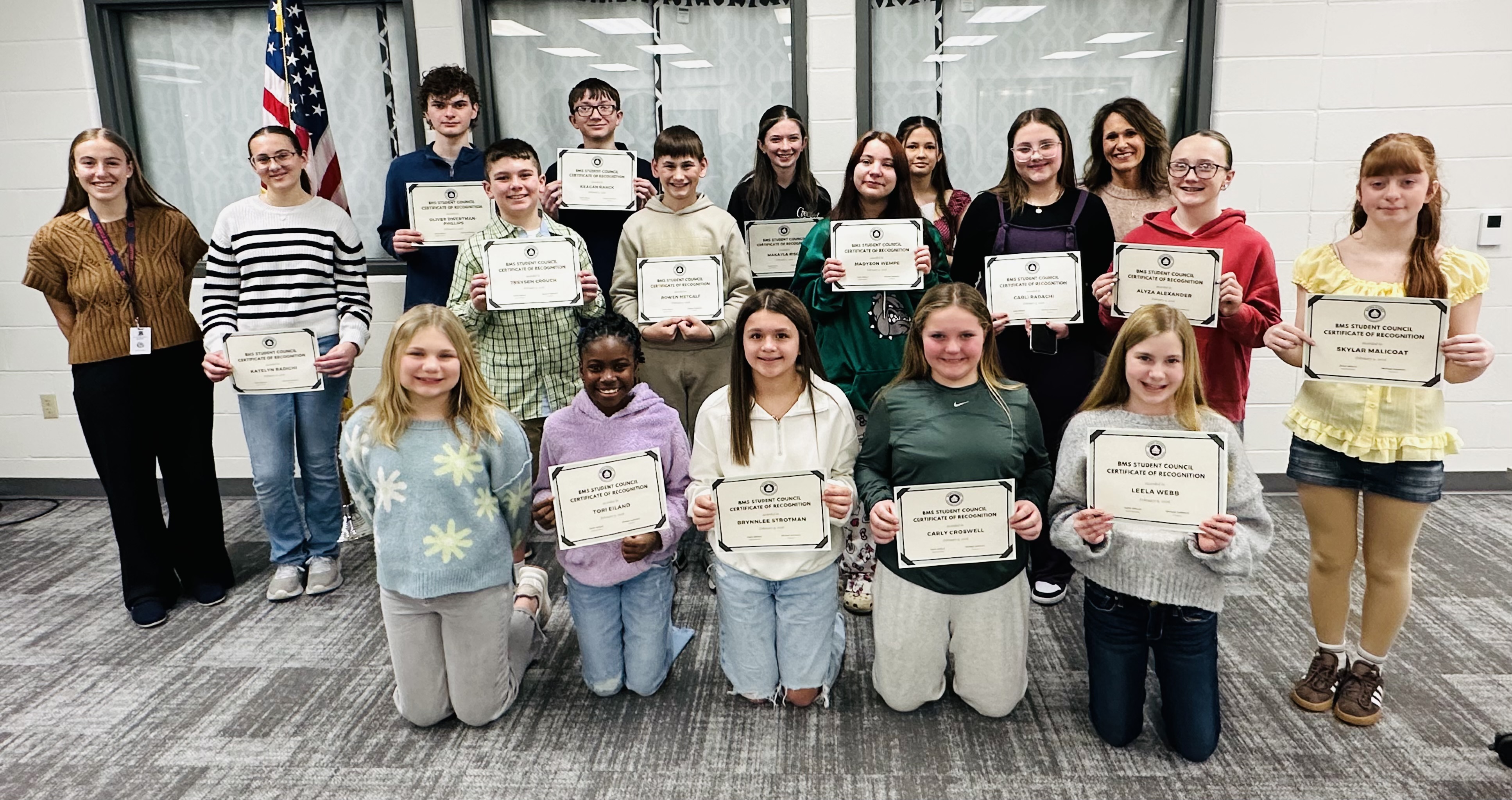 Batavia Middle and High School student council members being recognized holding certificates at the February 2026 Board Meeting