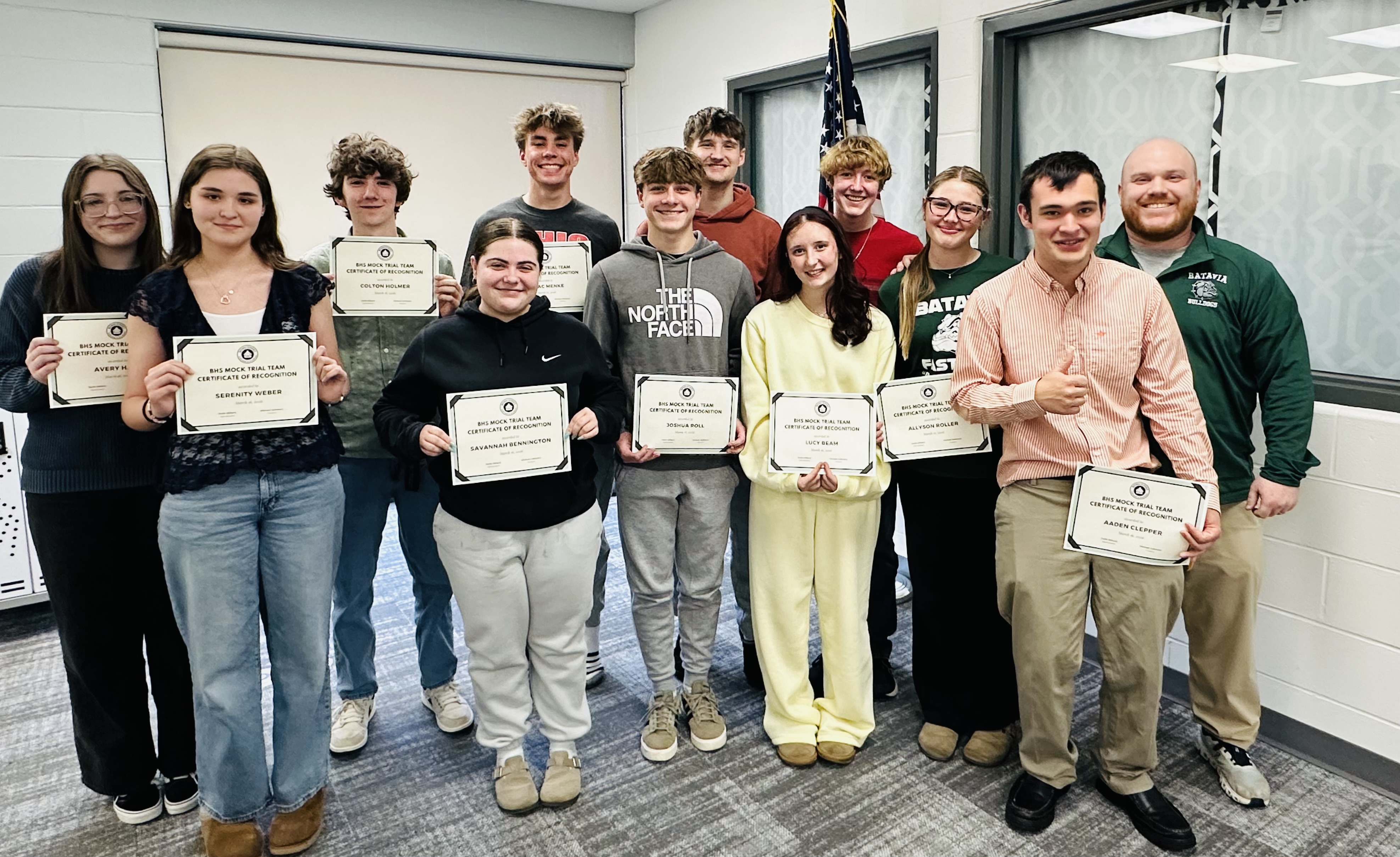 Batavia High School mock trial team holding certificates of accomplishment at the board of education meeting on 3/16/2026