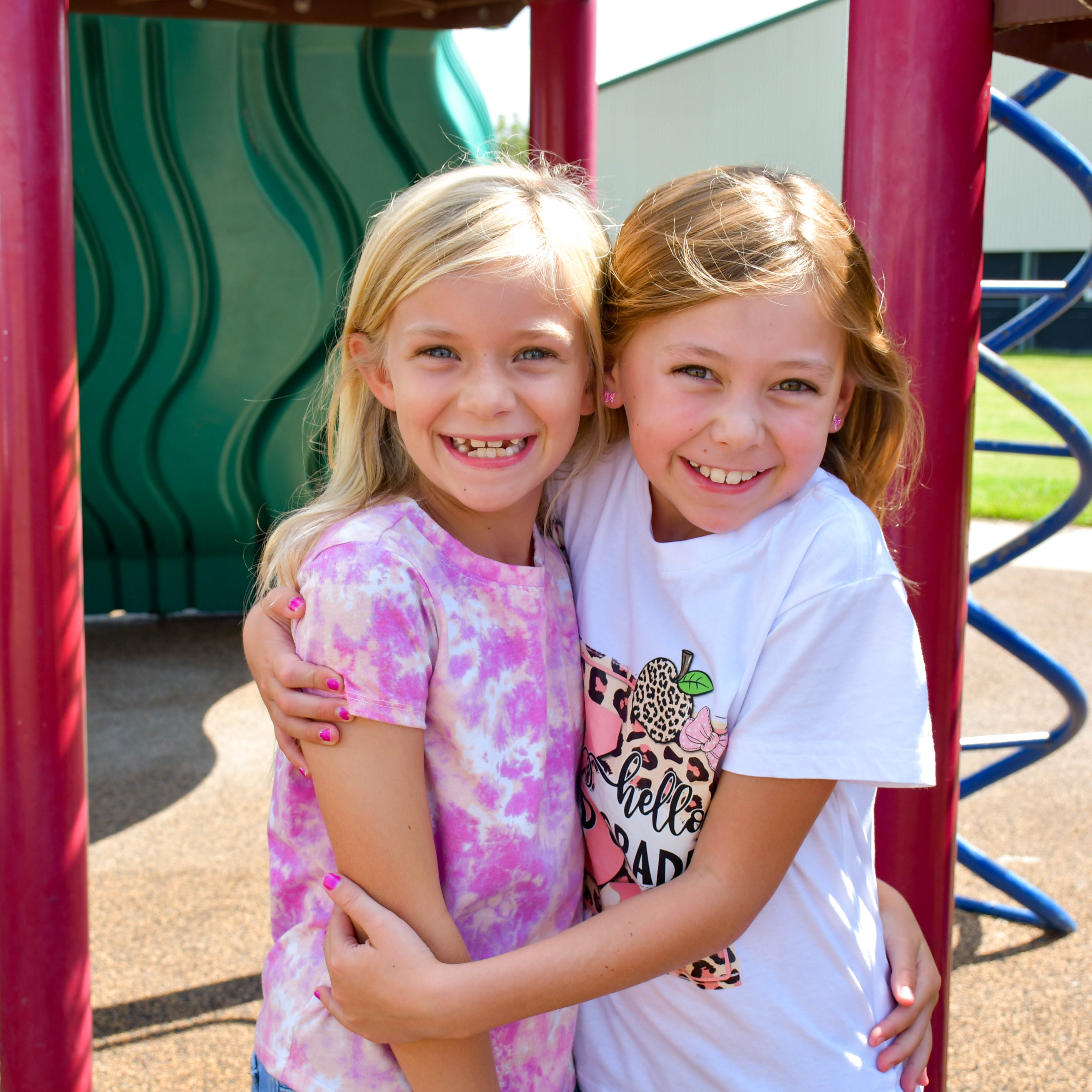 Mitchell First Day,  two girls smiling and hugging