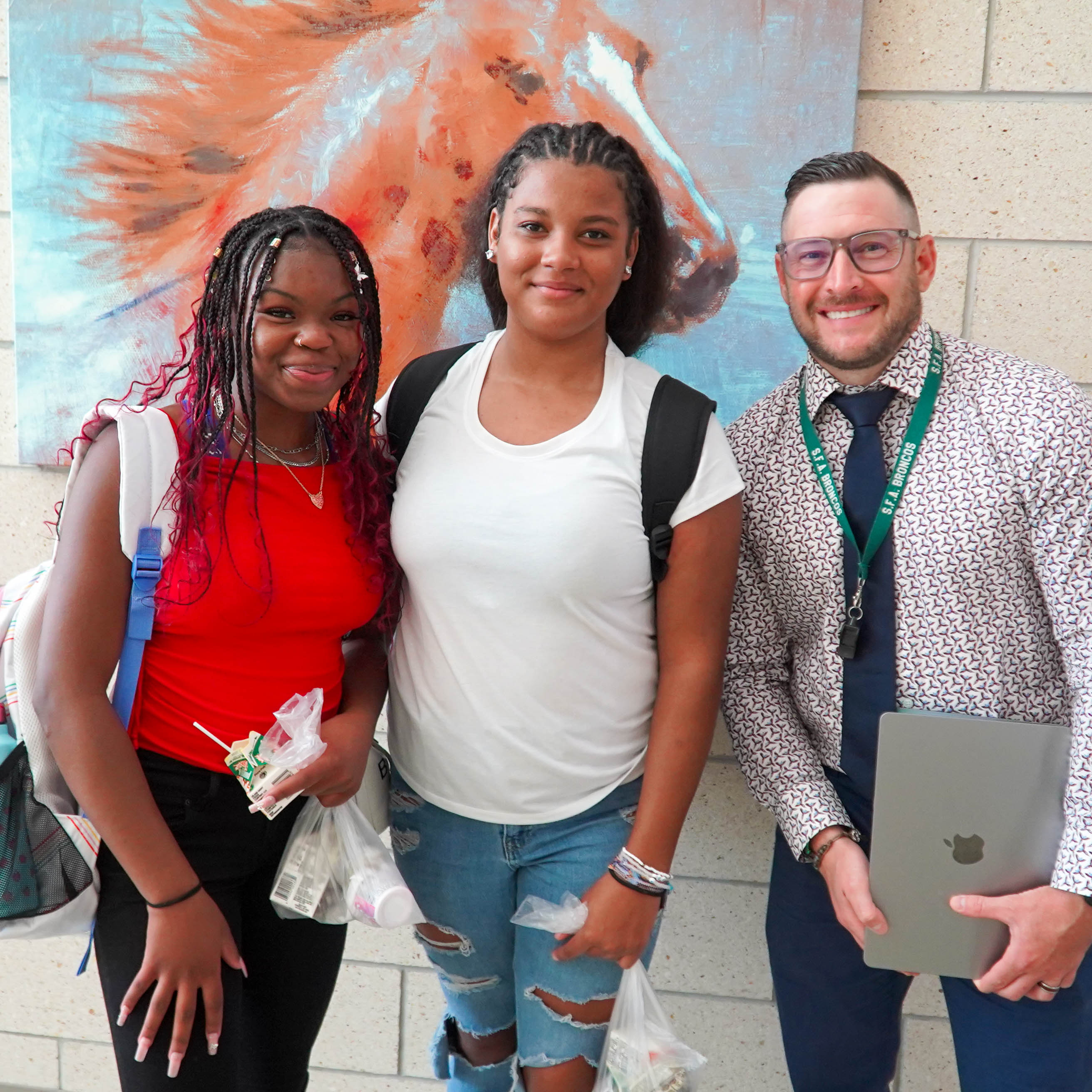 SFA First Day of School, two students with their teacher