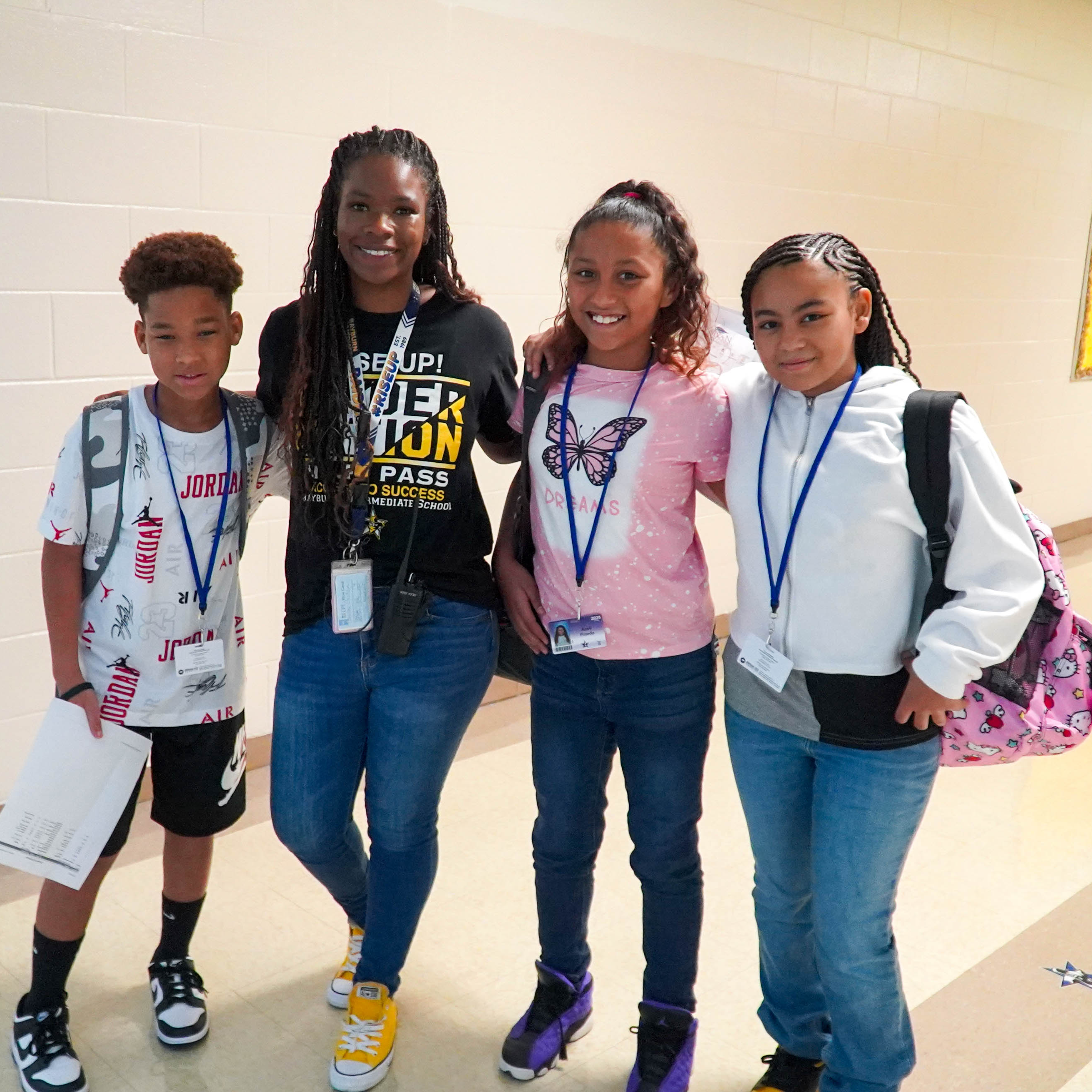 Rayburn First Day of School, three students with their teacher