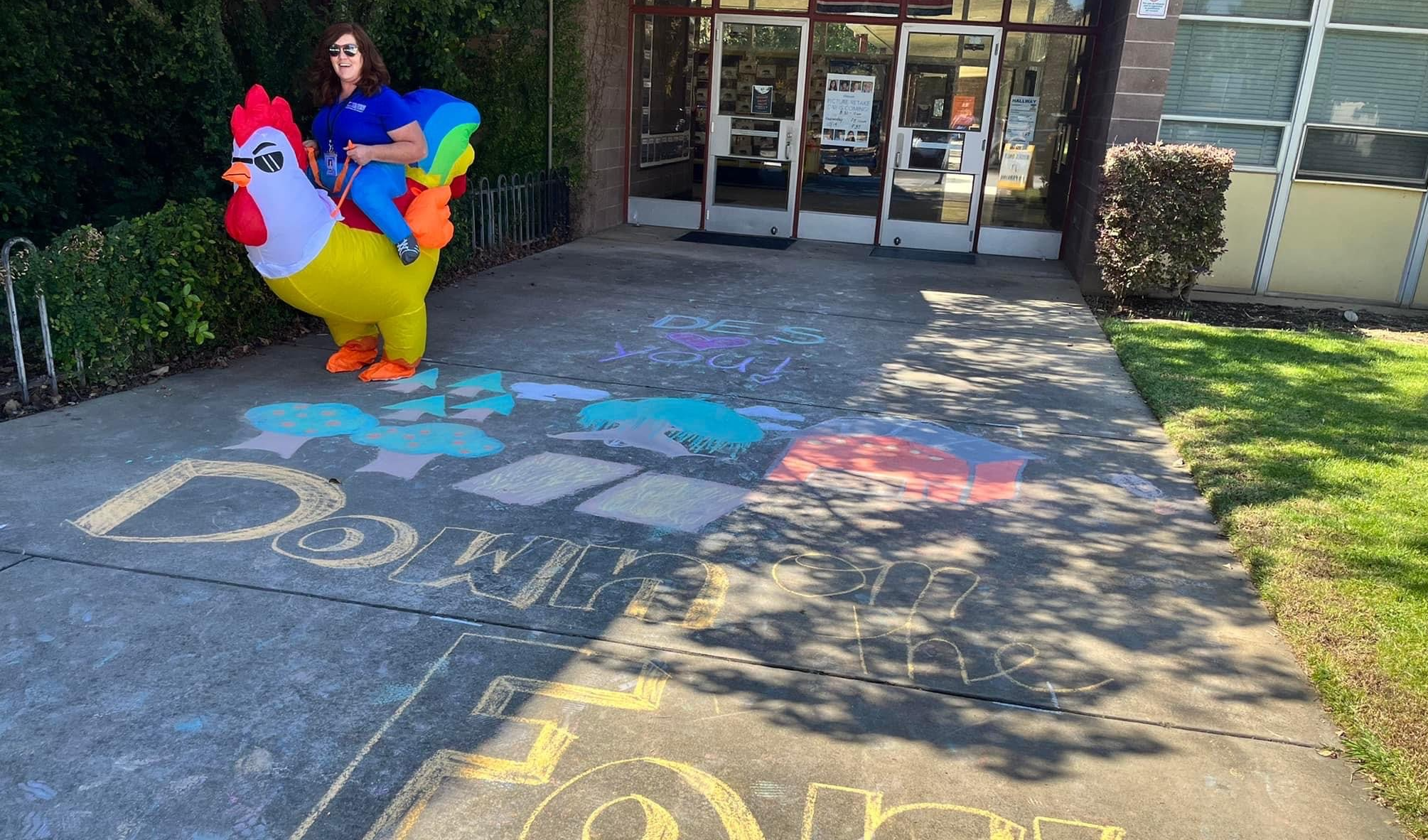 Chalk art on sidewalk & Mrs. Brown riding a chicken 