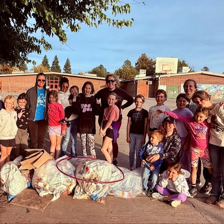 girls on the run club help picking up trash