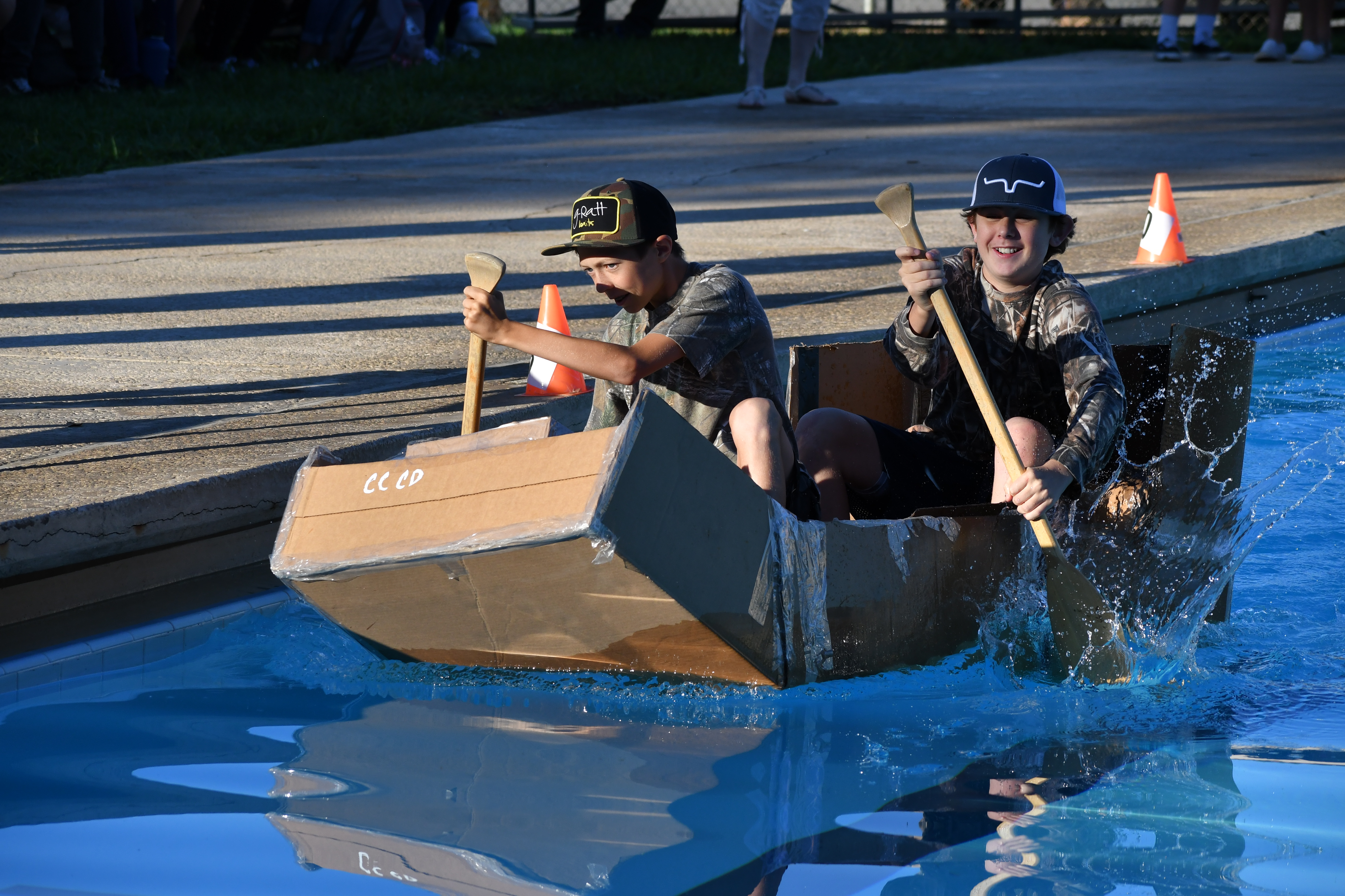 Students participating in boat race 
