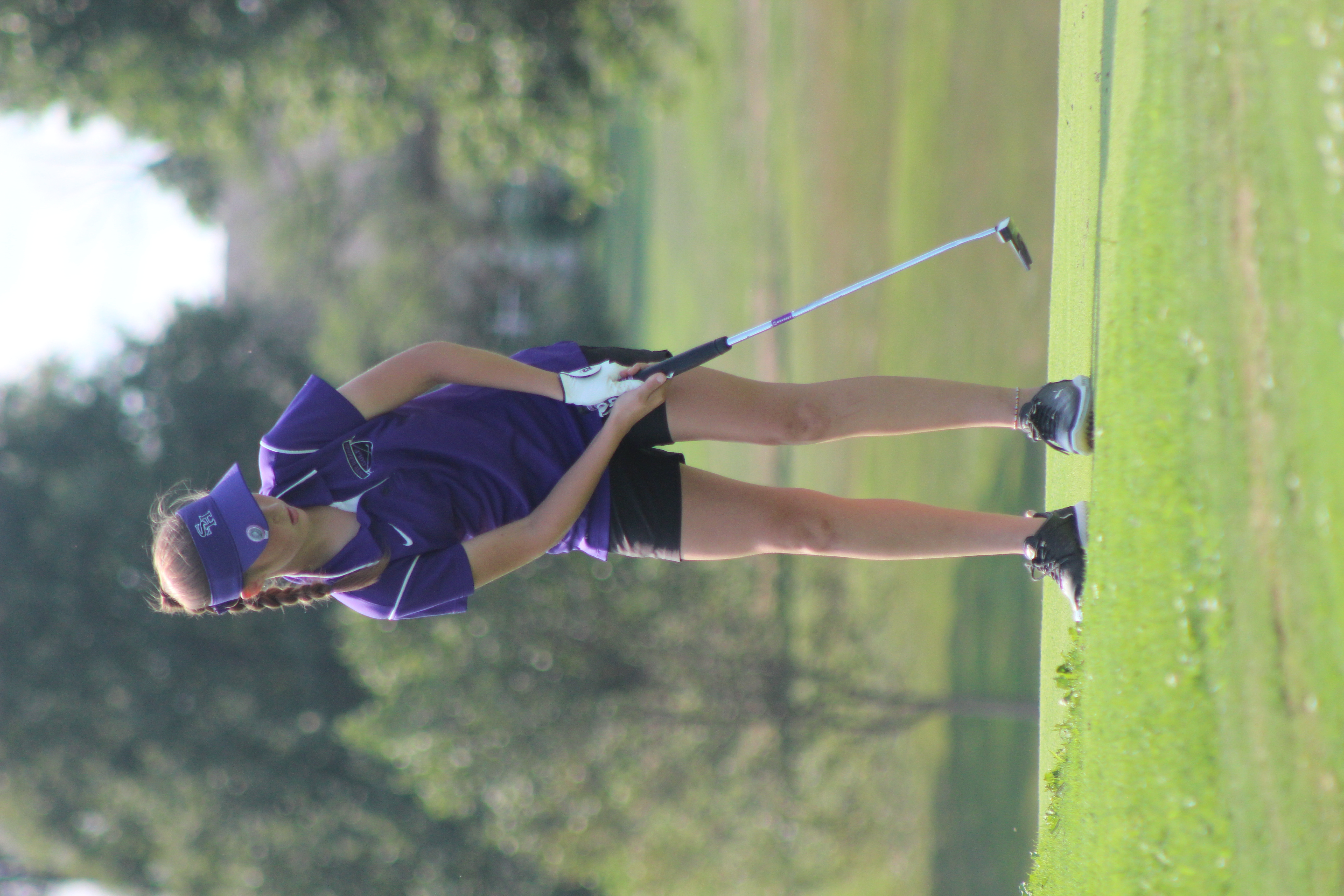 golfer lining up a shot