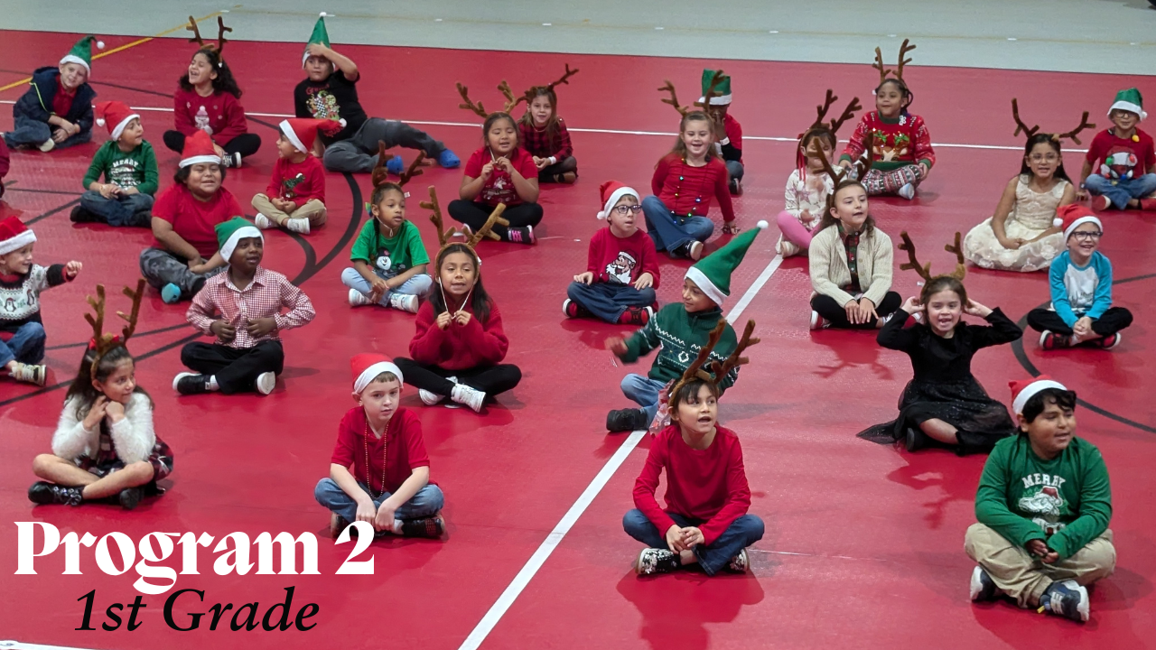 kids sitting on floor dressed in christmas outfits and head gear