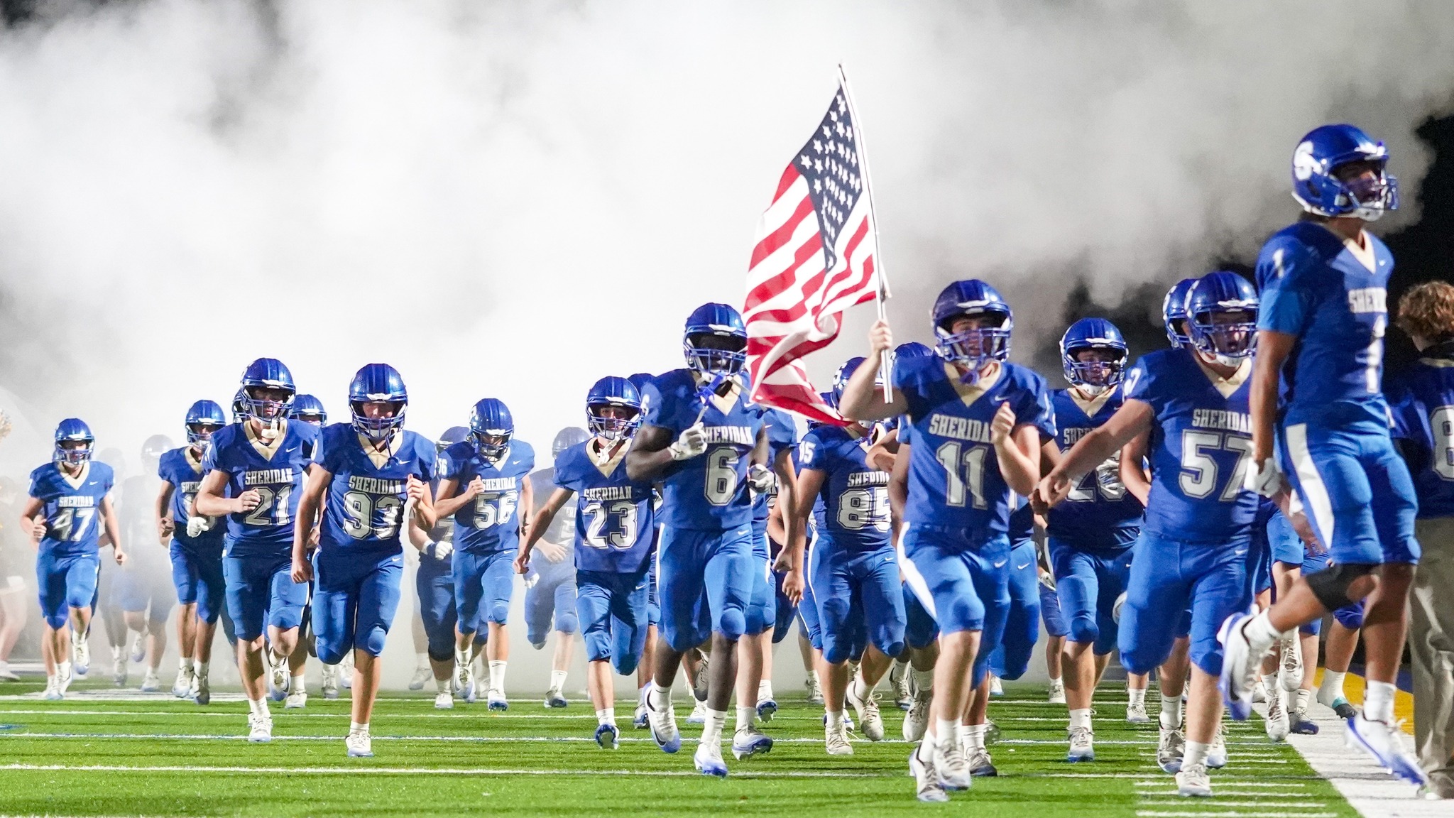 football team coming to field