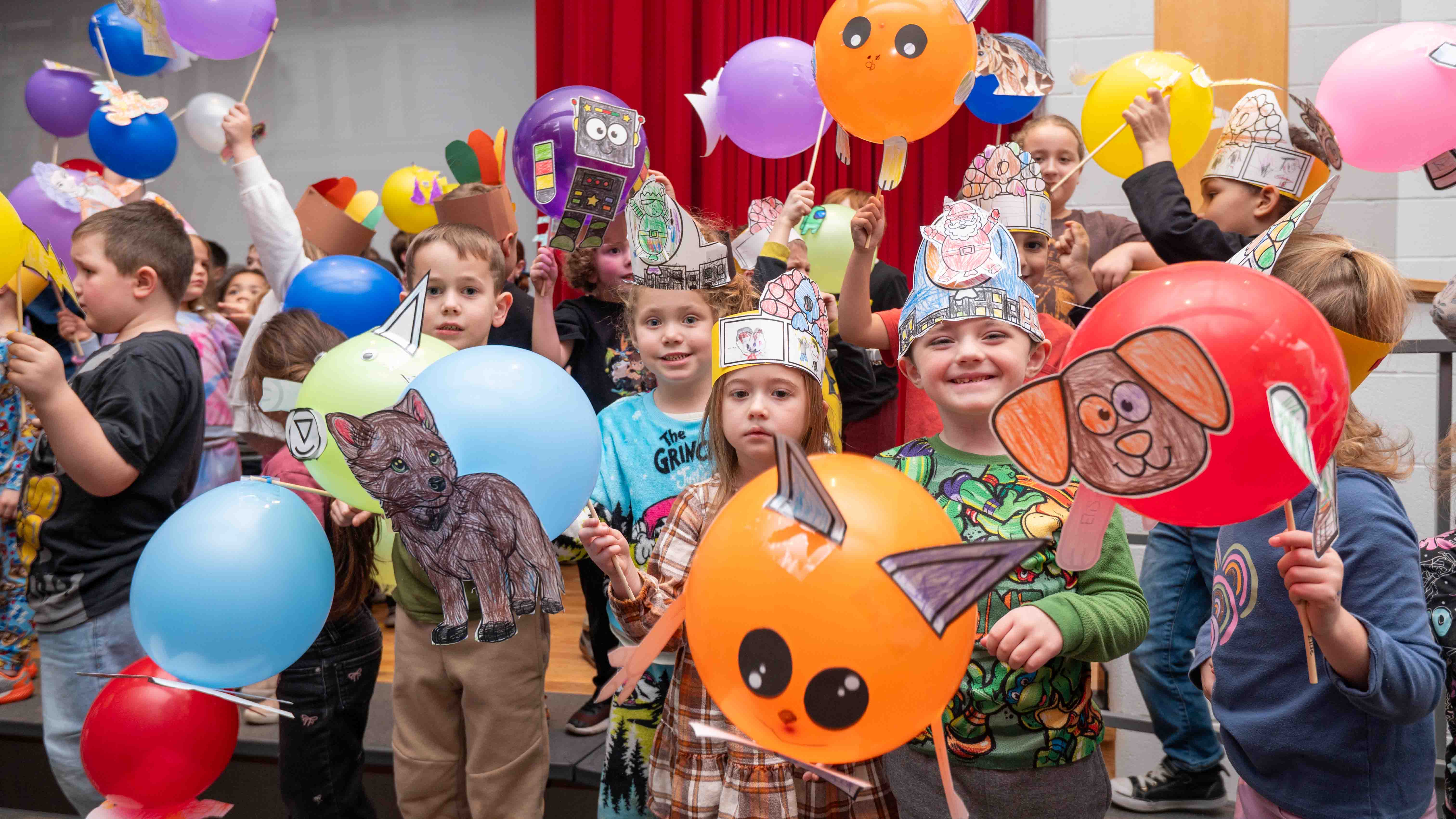 elementary students with balloons