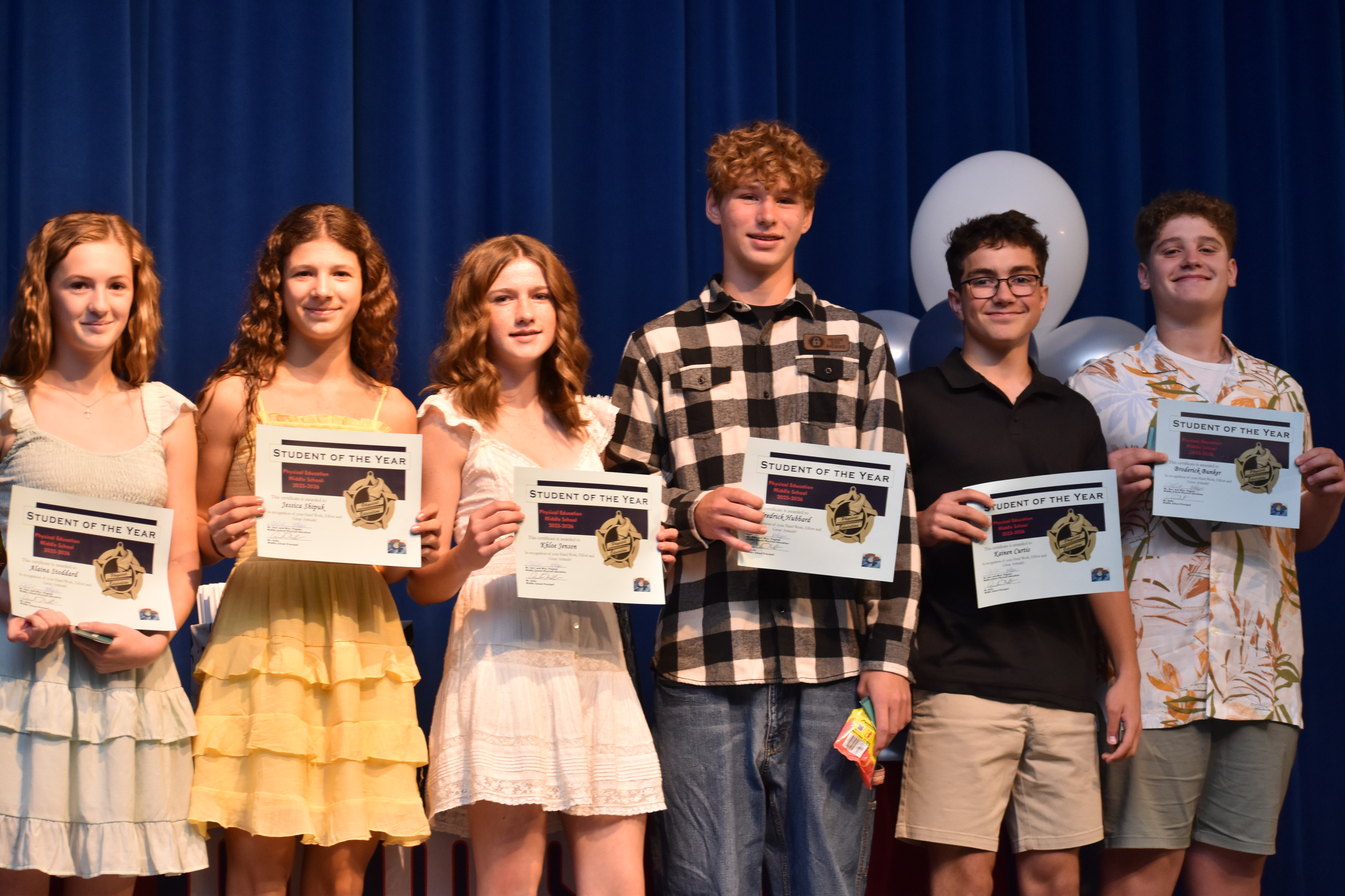 middle school students with awards