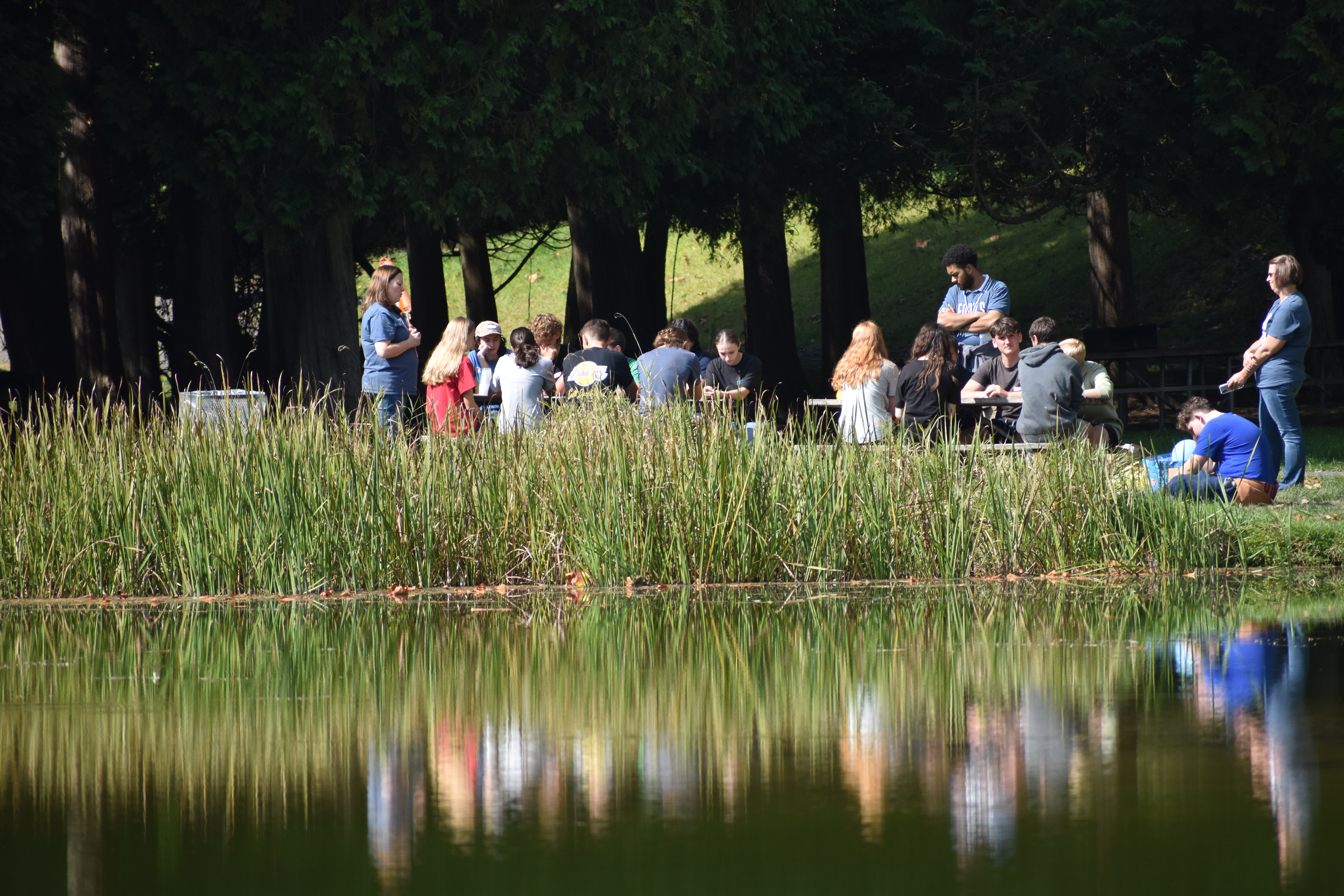 students near lake