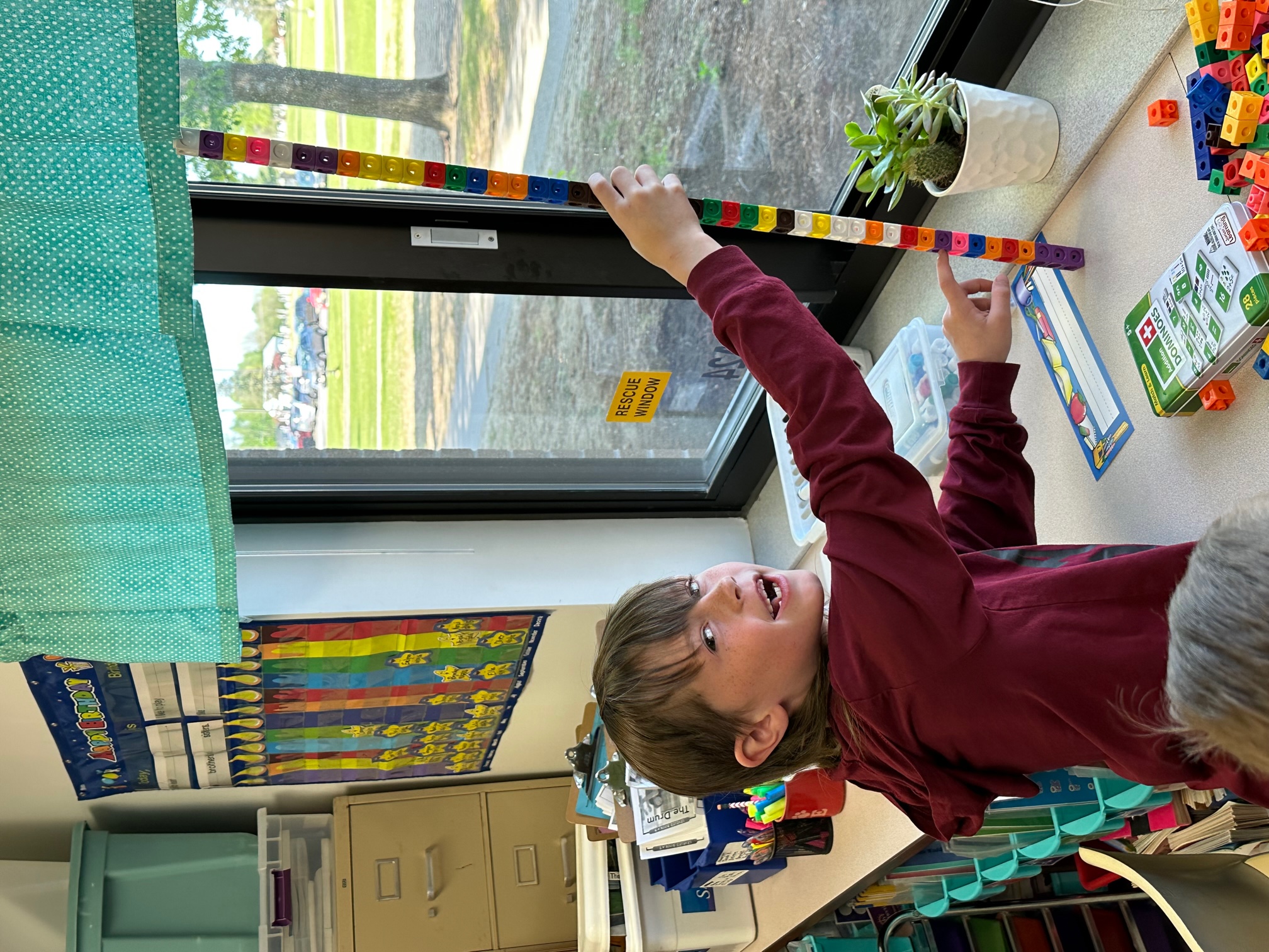 Mr. Berns' class uses unifix cubes to measure length and height.