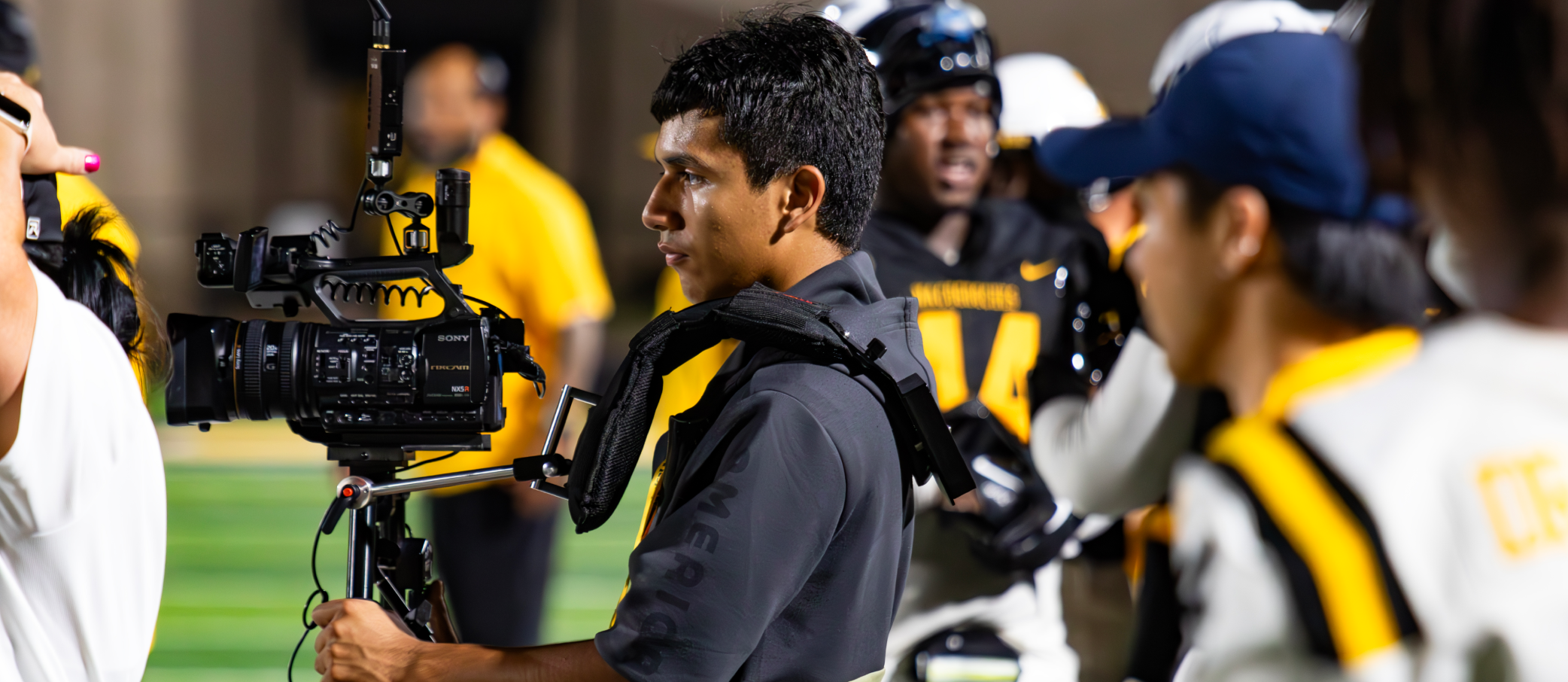 CTE Students filming a football game