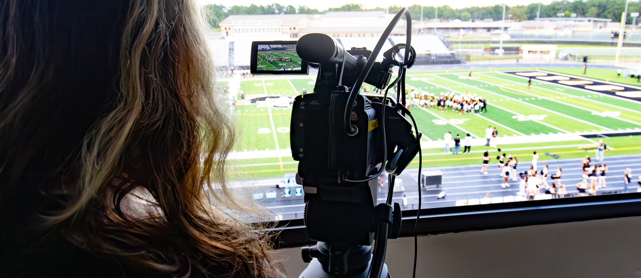 CTE Students filming a football game