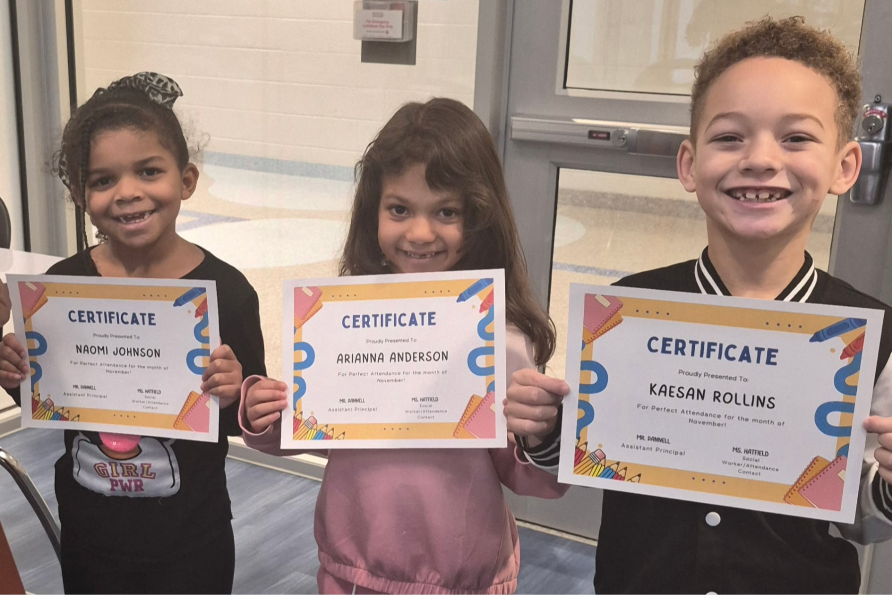 Students with Perfect Attendance from 1st grade (3 students, two girls and one boy)