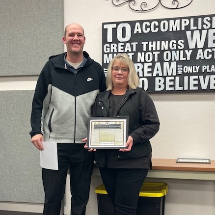 Special Services Director honoring an employee of the month