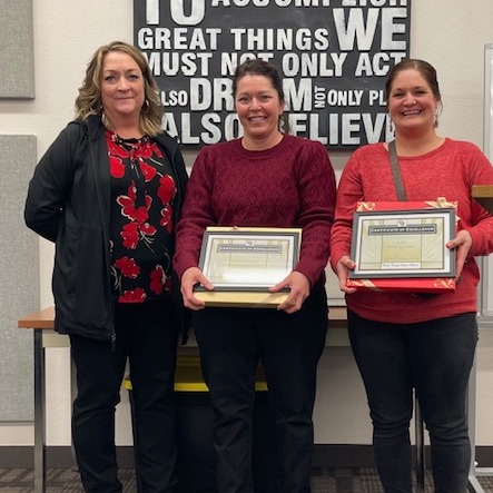 Principal honoring employees of the month